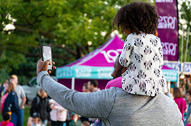 Man taking selfie with child